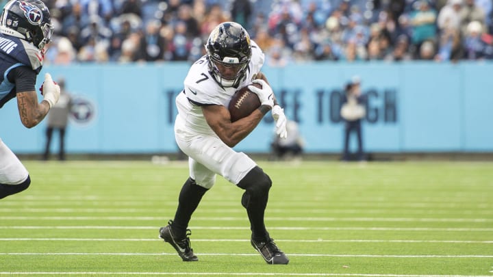 Jan 7, 2024; Nashville, Tennessee, USA;  Jacksonville Jaguars wide receiver Zay Jones (7) runs the ball against the Tennessee Titans during the second half at Nissan Stadium. Mandatory Credit: Steve Roberts-USA TODAY Sports