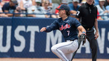 Ole Miss Rebels' Luke Hill (7) controls a ground ball as Ole Miss Rebels take on Vanderbilt Commodores during the SEC baseball tournament championship game at Hoover Met in Birmingham, Ala., on Sunday, May 25, 2025.