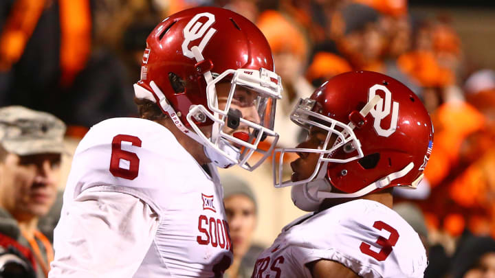 Nov 28, 2015; Stillwater, OK, USA; Oklahoma Sooners quarterback Baker Mayfield (6) celebrates with wide receiver Sterling Shepard after running for a touchdown in the second half against the Oklahoma State Cowboys at Boone Pickens Stadium. The Sooners defeated the Cowboys 58-23. Mandatory Credit: Mark J. Rebilas-USA TODAY Sports