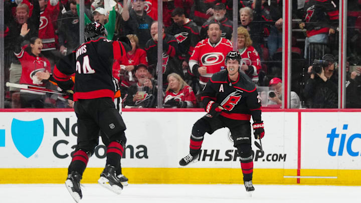Apr 29, 2025; Raleigh, North Carolina, USA; Carolina Hurricanes center Sebastian Aho (20) celebrates his goal against the New Jersey Devils during the second period in game five of the first round of the 2025 Stanley Cup Playoffs at Lenovo Center. Mandatory Credit: James Guillory-Imagn Images