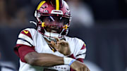 Sep 23, 2024; Cincinnati, Ohio, USA; Washington Commanders quarterback Jayden Daniels (5) throws during the fourth quarter against the Cincinnati Bengals at Paycor Stadium. Mandatory Credit: Joseph Maiorana-Imagn Images