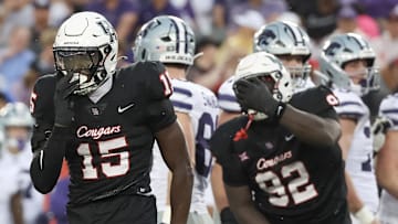 Houston defensive back Hershey McLaurin (15) reacts after tackling Kansas State running back DJ Giddens (31) 