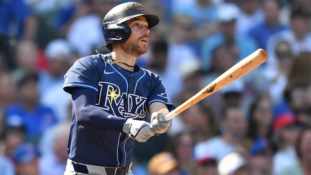 Sep 13, 2025; Chicago, Illinois, USA; Tampa Bay Rays second baseman Brandon Lowe (8) hits an RBI single against the Chicago Cubs during the sixth inning at Wrigley Field.