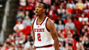 Feb 1, 2025; Raleigh, North Carolina, USA; North Carolina State Wolfpack guard Paul McNeil (2) reacts to his point ball during the first half of the game against the Clemson Tigers at Lenovo Center. Mandatory Credit: Jaylynn Nash-Imagn Images