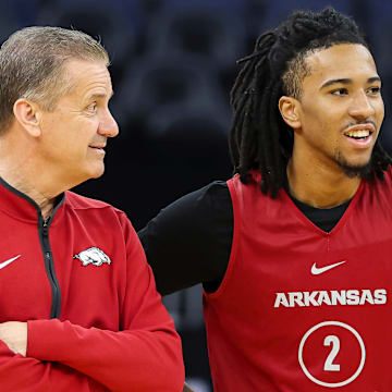 Arkansas Razorbacks coach John Calipari and freshman guard Boogie Fland enjoy a moment during practice at the Chase Center in San Francisco, Calif., on Wednesday, day before their Sweet 16 matchup with Texas Tech.