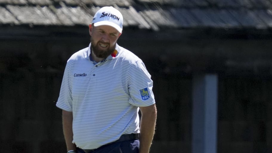 Shane Lowry reacts after missing a putt on the 11th green during the first round of the Masters 