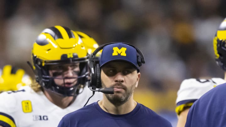 Dec 4, 2021; Indianapolis, IN, USA; Michigan Wolverines quarterbacks coach Matt Weiss against the Iowa Hawkeyes in the Big Ten Conference championship game at Lucas Oil Stadium. Mandatory Credit: Mark J. Rebilas-Imagn Images