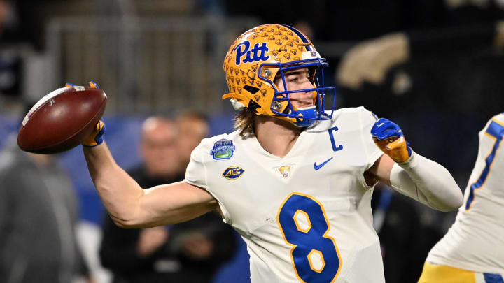 Dec 4, 2021; Charlotte, NC, USA; Pittsburgh Panthers quarterback Kenny Pickett (8) looks to pass in the first quarter of the ACC championship game at Bank of America Stadium. Mandatory Credit: Bob Donnan-USA TODAY Sports