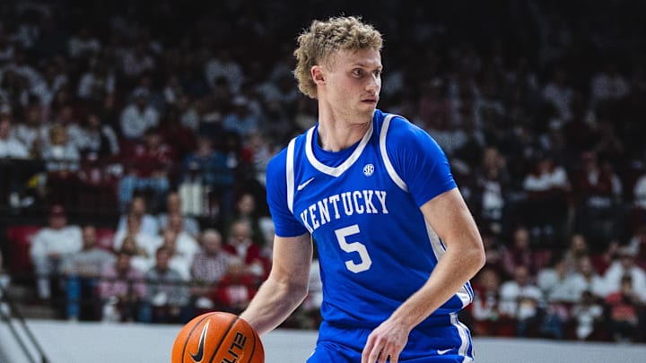 Feb 22, 2025; Tuscaloosa, Alabama, USA; Kentucky Wildcats guard Collin Chandler (5) drives the ball against Alabama Crimson Tide center Clifford Omoruyi (11) during the second half at Coleman Coliseum. Mandatory Credit: Will McLelland-Imagn Images