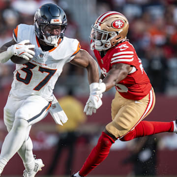 August 9, 2025; Santa Clara, California, USA; Denver Broncos running back RJ Harvey (37) runs the football against San Francisco 49ers linebacker Nick Martin (45) during the first quarter at Levi's Stadium. 