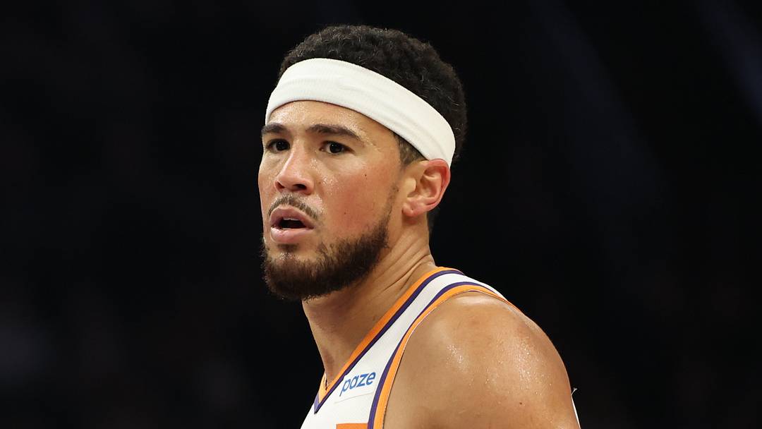 Oct 16, 2026; Phoenix, Arizona, USA;  Phoenix Suns guard Devin Booker (15) looks on against the Utah Jazz in the first half at Mortgage Matchup Center.  Mandatory Credit: Anna Carrington-Imagn Images