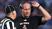 Sep 20, 2025; Durham, North Carolina, USA;  NC State Wolfpack head coach Dave Doeren reacts to a call during the fourth quarter against the Duke Blue Devils at Wallace Wade Stadium. Mandatory Credit: Zachary Taft-Imagn Images