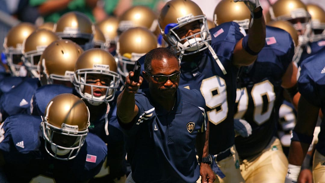 Sep 6, 2003; South Bend, IN, USA; FILE PHOTO: Notre Dame head football coach Tyrone Willingham leads his team onto the field at Notre Dame Stadium before the 2003 season opener against Washington State.  Notre Dame athletic director Kevin White announced Tuesday Nov. 30, 2004 that Tyrone Willingham would not be retained as head coach at Notre Dame. Mandatory Credit: Photo By Matt Cashore-Imagn Images Copyright (c) 2004 Matt Cashore
