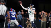 Oct 2, 2023; East Rutherford, New Jersey, USA; Seattle Seahawks quarterback Drew Lock (2) throws a pass against New York Giants safety Jason Pinnock (27) during the second quarter at MetLife Stadium. Mandatory Credit: Brad Penner-USA TODAY Sports