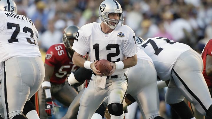 Jan 26, 2003; San Diego, CA, USA; FILE PHOTO; Oakland Raiders quarterback Rich Gannon (12) in action against the Tampa Bay Buccaneers during Super Bowl XXXVII at Qualcomm Stadium. The Bucs defeated the Raiders 48-21. Mandatory Credit: MPS-USA TODAY Sports