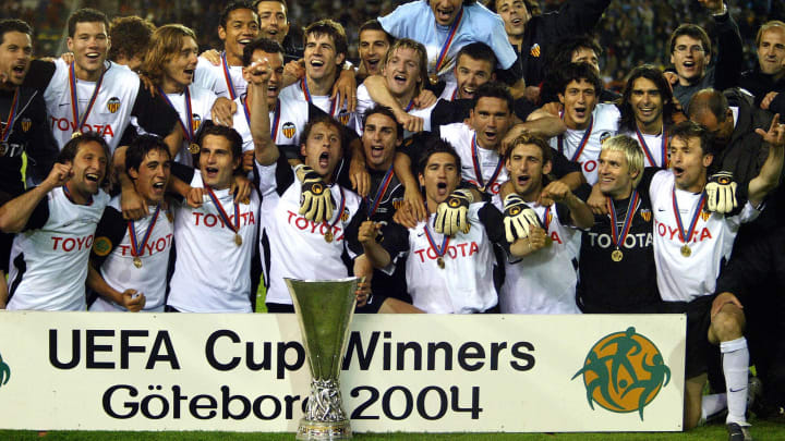 The Valencia team pose with the trophy a