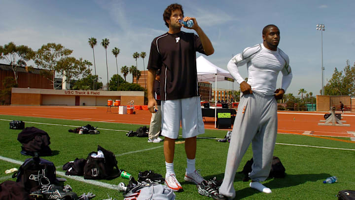 Apr 2, 2006; Los Angeles, CA, USA; Southern California Trojans quarterback (11) Matt Leinart and tailback (5) Reggie Bush prepare for the 2006 USC Pro Day at Katherine B. Loker Stadium in Los Angeles, CA. Mandatory Credit: Photo By Mark J. Rebilas-Imagn Images © Copyright Mark J. Rebilas