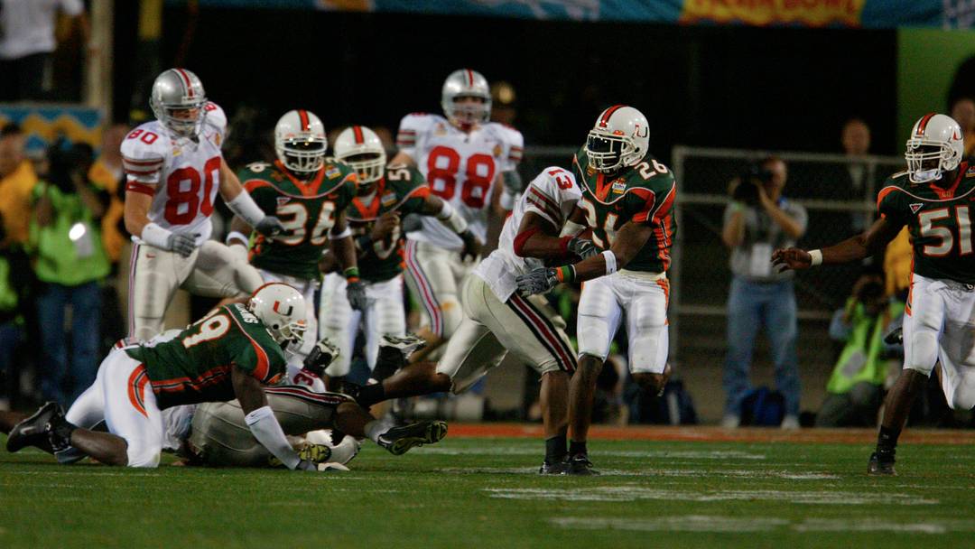 Ohio State's Maurice Clarett starts to pull the ball out of the hands of Sean Taylor (26). Miami #51 is Jonathan Vilma in the fourth quarter of the National Football Championships at the Sun Devil Stadium in Tempe, Arizona, January 3, 2003. Ohio State's Maurice Clarett starts to pull the ball out of the hands of Sean Taylor (26). Miami #51 is Jonathan Vilma in the fourth quarter of the National Football Championships at the Sun Devil Stadium in Tempe, Arizona, January 3, 2003.
