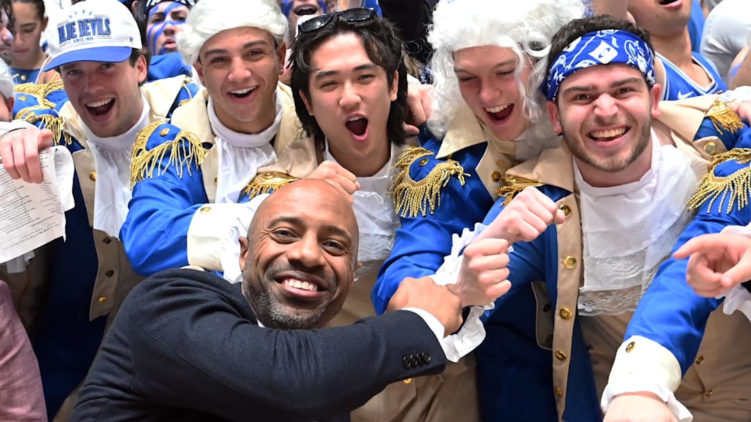 Mar 9, 2024; Durham, North Carolina, USA;  ESPN basketball commentator Jay Williams (front left) greets Duke students prior to a game between the North Carolina Tar Heels and the Duke Blue Devils at Cameron Indoor Stadium. Mandatory Credit: Rob Kinnan-Imagn Images