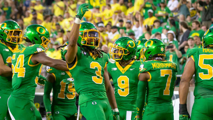 Oregon Ducks defensive back Brandon Johnson and fellow members of the Oregon defense celebrate an interception as the Oregon Ducks host the Idaho Vandals Saturday, Aug. 31, 2024 at Autzen Stadium in Eugene, Ore.