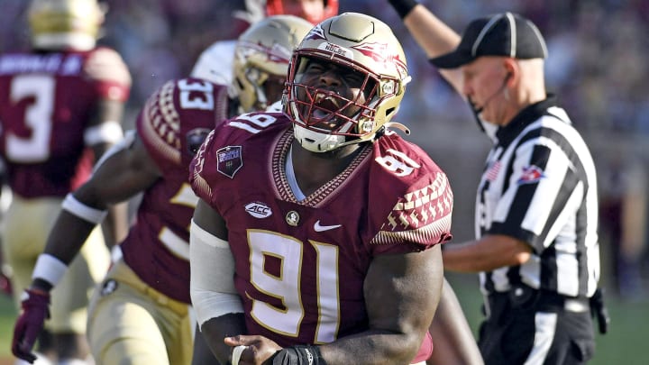 Sep 25, 2021; Tallahassee, Florida, USA; Florida State Seminoles defensive tackle Robert Cooper (91) celebrates after a play during the game against the Louisville Cardinals at Doak S. Campbell Stadium. Mandatory Credit: Melina Myers-USA TODAY Sports