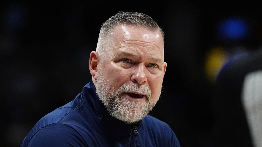 Apr 6, 2025; Denver, Colorado, USA; Denver Nuggets head coach Michael Malone reacts towards referee Danielle Scott (87) in the second half against the Indiana Pacers at Ball Arena. Mandatory Credit: Ron Chenoy-Imagn Images