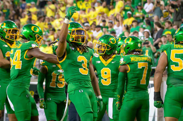 Ducks defensive back Brandon Johnson celebrates his teammates after an interception.