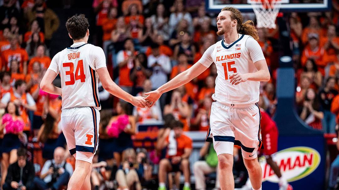 Illinois guard Ethan Brown (34) and forward Jake Davis (15) acknowledge a play in the Illini's 101-66 exhibition win over UIC on Wednesday at the State Farm Center in Champaign, Illinois. Illinois guard Ethan Brown (34) and forward Jake Davis (15) acknowledge a play in the Illini's 101-66 exhibition win over UIC on Wednesday at the State Farm Center in Champaign, Illinois.