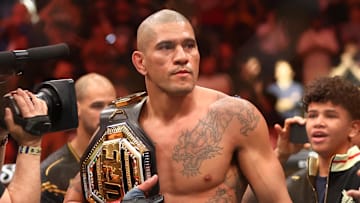 Apr 13, 2024; Las Vegas, Nevada, USA; Alex Pereira celebrates with the championship belt during UFC 300 at T-Mobile Arena. Mandatory Credit: Mark J. Rebilas-Imagn Images