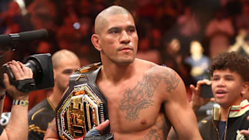 Apr 13, 2024; Las Vegas, Nevada, USA; Alex Pereira celebrates with the championship belt during UFC 300 at T-Mobile Arena. Mandatory Credit: Mark J. Rebilas-Imagn Images