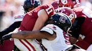 South Carolina Gamecocks defensive tackle T.J. Sanders (90) sacks Oklahoma Sooners quarterback Jackson Arnold (11) during a college football game between the University of Oklahoma Sooners (OU) and the South Carolina Gamecocks