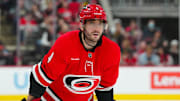 Nov 29, 2024; Raleigh, North Carolina, USA;  Carolina Hurricanes defenseman Shayne Gostisbehere (4) looks on against the Florida Panthers during the first period at Lenovo Center. Mandatory Credit: James Guillory-Imagn Images