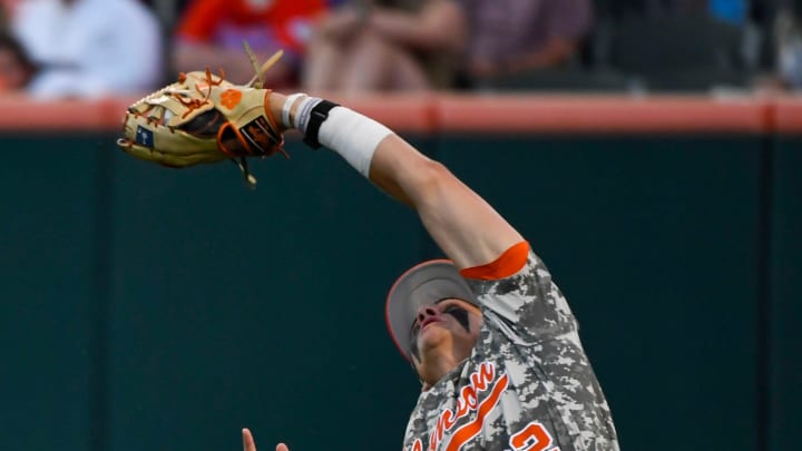 Clemson freshman Nathan Hall (22) catches a fly ball during a game against Georgia at Doug Kingsmore Stadium in Clemson Tuesday, April 18, 2023.

Gre Ml Clemsonvgeorgiabaseball 04182023 022