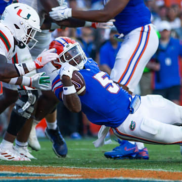 Florida Gators running back Treyaun Webb (5) drives for a touchdown during the season opener at Ben Hill Griffin Stadium in Gainesville, FL on Saturday, August 31, 2024 against the University of Miami Hurricanes in the second half. Miami defeated the Gators 41-17. [Doug Engle/Gainesville Sun]