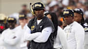 Aug 29, 2025; Boulder, Colorado, USA; Colorado Buffaloes head coach Deion Sanders on the sidelines in the second quarter against the Georgia Tech Yellow Jackets at Folsom Field. Mandatory Credit: Ron Chenoy-Imagn Images