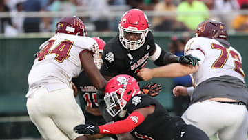 Savannah Christian's Jaden Miles and LaDamion Guyton look to stop New Hampstead's Kameron Blake-Mazes in the backfield on Friday, August 23, 2024 at Pooler Stadium.