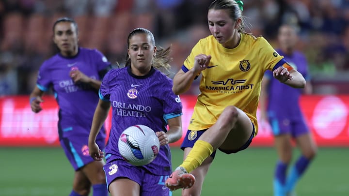 May 23, 2025; Sandy, Utah, USA; Utah Royals FC defender Kate Del Fava (8) kicks the ball away from Orlando Pride forward Summer Yates (28) during the second half at America First Field. Mandatory Credit: Rob Gray-Imagn Images