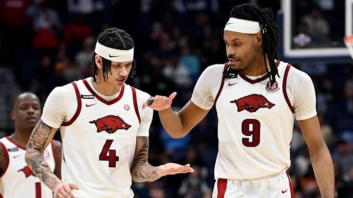 Arkansas’ Trevon Brazile (4) and Jonas Aidoo (9) congratulate each other after their win against South Carolina in a NCAA college basketball first round game at the men’s Southeastern Conference Tournament Wednesday, March 12, 2025, in Nashville, Tenn.