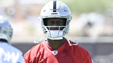 Jun 10, 2025; Henderson, NV, USA; Las Vegas Raiders quarterback Geno Smith (7) looks on during the team stretch during Las Vegas Raiders Minicamp at Intermountain Health Performance Center. Mandatory Credit: Candice Ward-Imagn Images