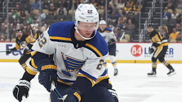 Mar 13, 2025; Pittsburgh, Pennsylvania, USA; St. Louis Blues defenseman Ryan Suter (22) handles the puck against the Pittsburgh Penguins during the first period at PPG Paints Arena. Mandatory Credit: Charles LeClaire-Imagn Images