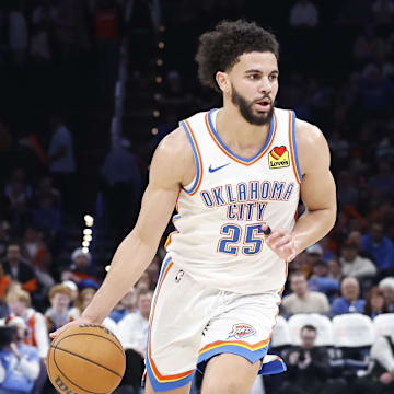 Dec 23, 2024; Oklahoma City, Oklahoma, USA; Oklahoma City Thunder guard Ajay Mitchell (25) dribbles the ball down the court against the Washington Wizards during the second half at Paycom Center. Mandatory Credit: Alonzo Adams-Imagn Images