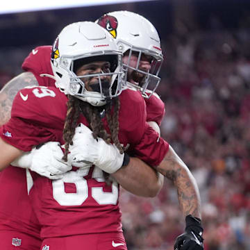 Arizona Cardinals Xavier Weaver (89) celebrates his touchdown with teammate Jake Curhan (64) against the Kansas City Chiefs during their preseason game at State Farm Stadium on Aug. 9, 2025.