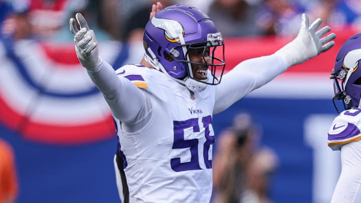 Sep 8, 2024; East Rutherford, New Jersey, USA; Minnesota Vikings linebacker Jonathan Greenard (58) celebrates a sack with linebacker Dallas Turner (15) during the first half against the New York Giants at MetLife Stadium. Mandatory Credit: Vincent Carchietta-Imagn Images