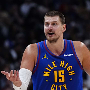 May 9, 2025; Denver, Colorado, USA; Denver Nuggets center Nikola Jokic (15) reacts to a foul called in the first half against the Oklahoma City Thunder during game three of the second round for the 2025 NBA Playoffs at Ball Arena. Mandatory Credit: Ron Chenoy-Imagn Images