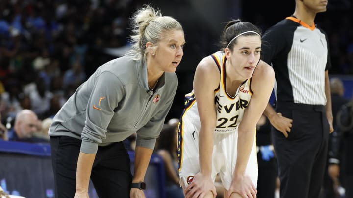 Indiana Fever head coach Christie Sides talks with guard Caitlin Clark 