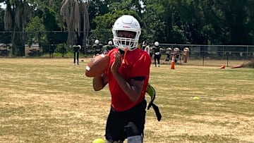 Jones quarterback Dereon Coleman sets up to throw during practice Friday in Orlando.