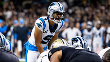 Sep 8, 2024; New Orleans, Louisiana, USA;  Carolina Panthers quarterback Bryce Young (9) calls a play at the line against the New Orleans Saints during the second half at Caesars Superdome. Mandatory Credit: Stephen Lew-Imagn ImagesNew Orleans Saints cornerback Will Harris (5)