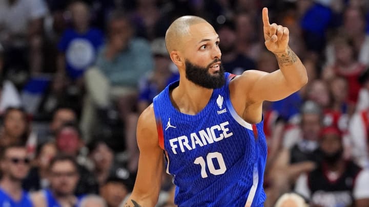 Jul 30, 2024; Villeneuve-d'Ascq, France; France shooting guard Evan Fournier (10) brings the ball up court against Japan in men’s basketball group B play during the Paris 2024 Olympic Summer Games at Stade Pierre-Mauroy.