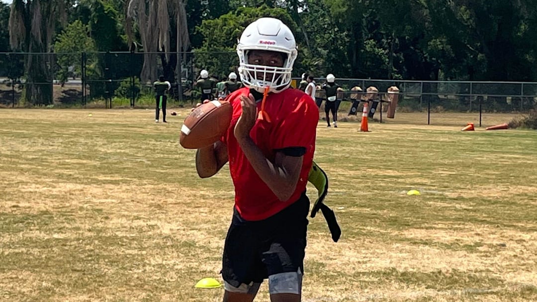 Jones quarterback Dereon Coleman sets up to throw during practice Friday in Orlando.