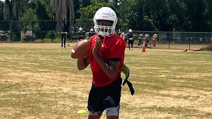 Jones quarterback Dereon Coleman sets up to throw during practice Friday in Orlando.